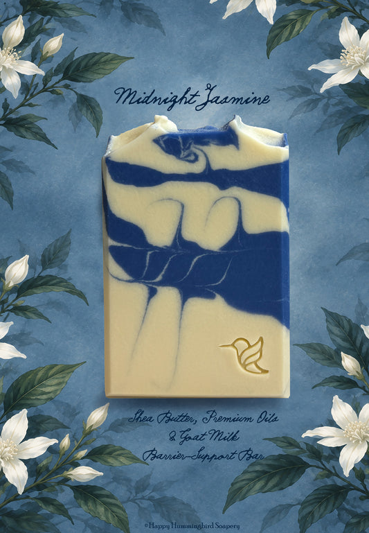 Midnight Jasmine cold-process goat milk soap bar featuring a blue and cream swirl design, stamped with Happy Hummingbird Soapery logo, on botanical watercolor night jasmine blossoms. 