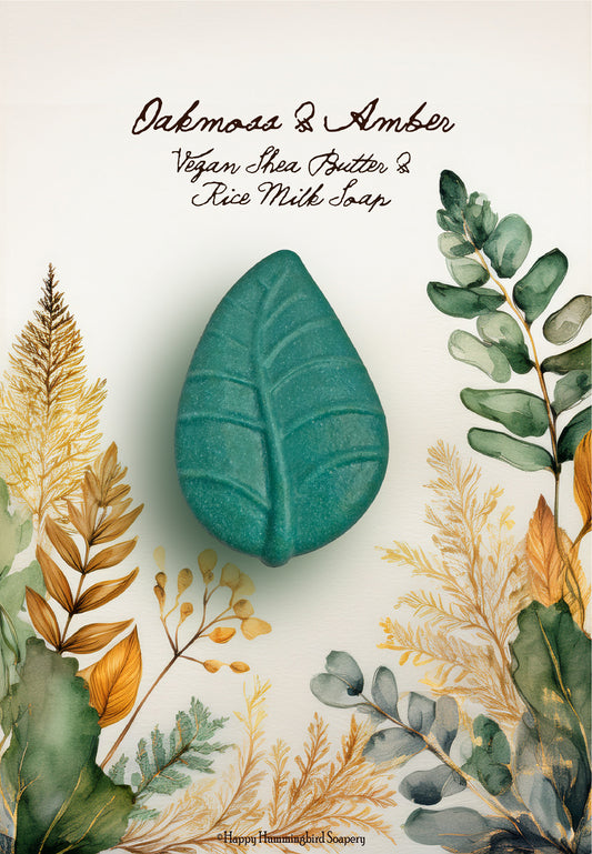 Oakmoss & Amber leaf-shaped vegan shea butter rice milk soap on a green & gold botanical illustration foliage-Happy Hummingbird Soapery.