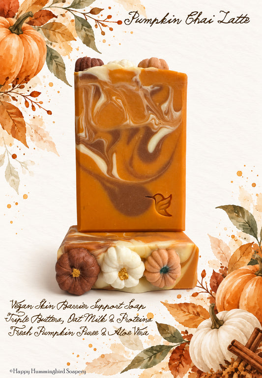 Two Pumpkin Chai Latte vegan soap bars with pumpkin decorations and orange, cream and brown swirls against an autumn watercolor background.