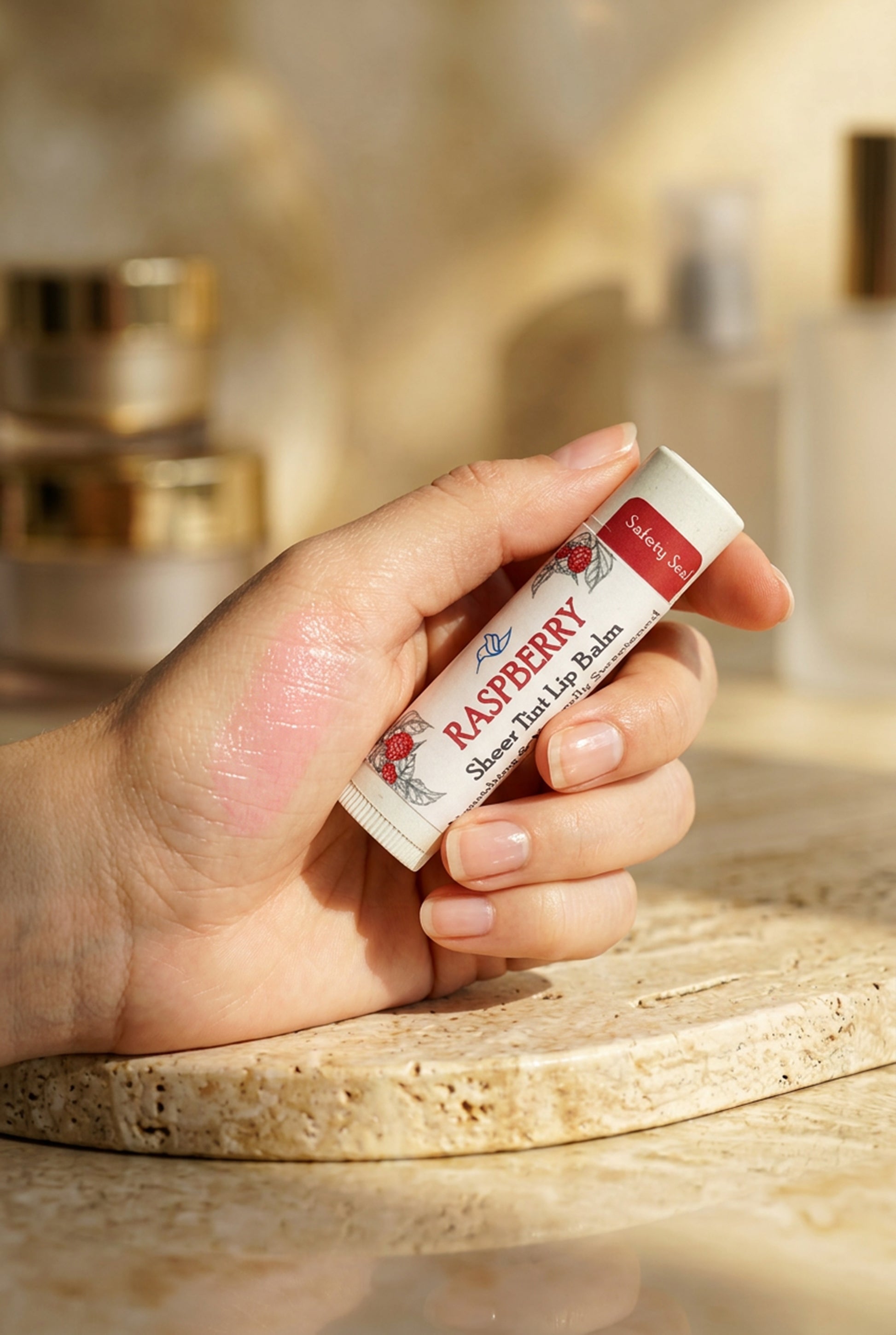 Raspberry Sheer Tint Lip Balm by Happy Hummingbird Soapery – hydrating treatment with a subtle, natural pink finish.