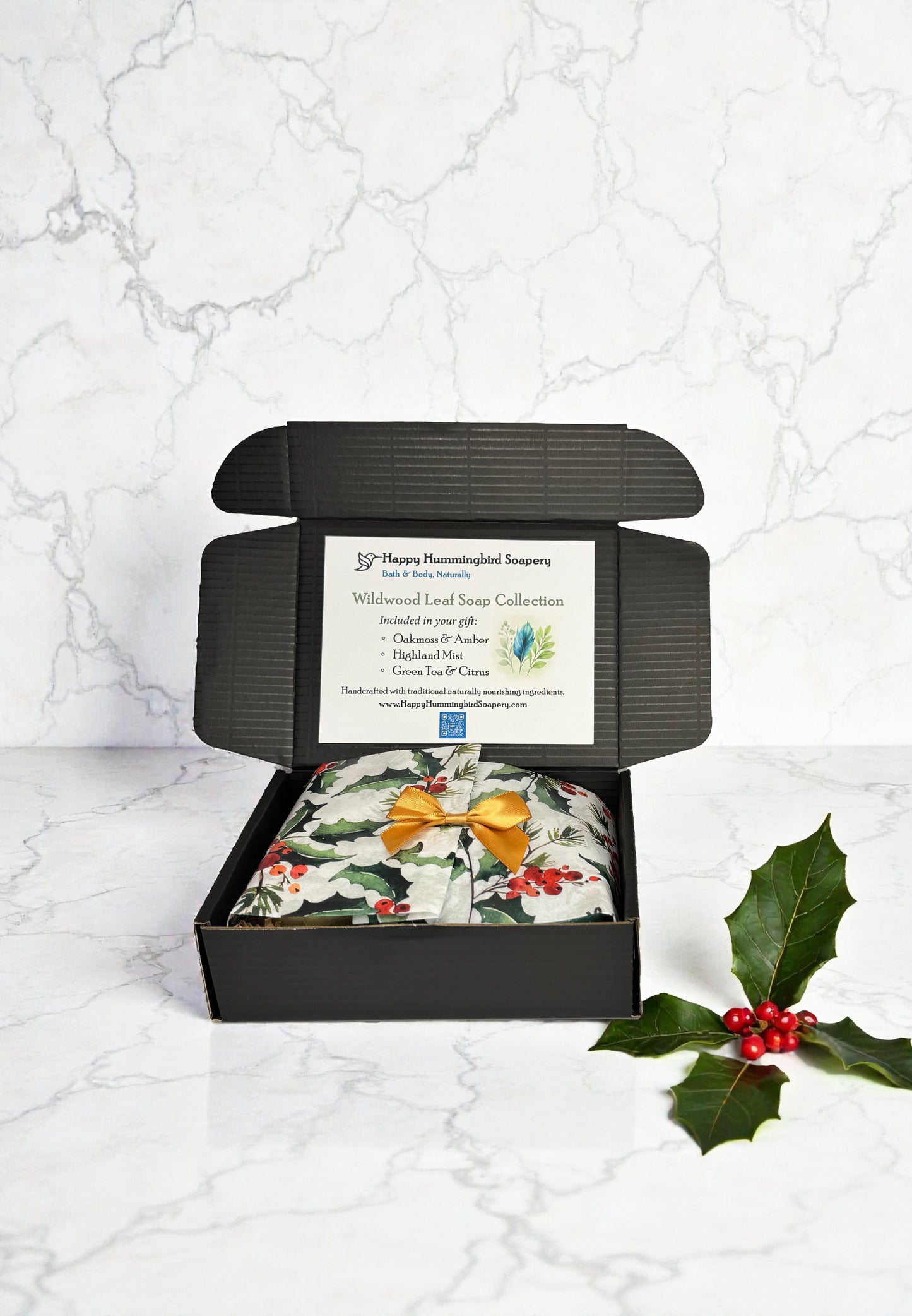 Wildwood Leaf Soap Gift Set with wrapped trio of vegan leaf soaps in gift box with holly tissue and product card.