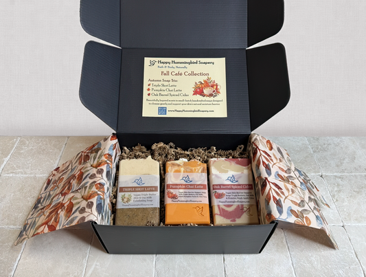 Open Fall Café Collection soap gift box showcasing three handcrafted vegan bar soaps: Triple Shot Latte, Pumpkin Chai Latte, and Oak Barrel Spiced Cider.